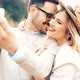 Beautiful Couple Taking Selfies and Smiling While Traveling - VideoHive Item for Sale