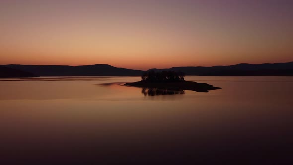 Aerial Panoramic View of Island on a Batak Reservoir in Sunrise Rhodopa Mountains Bulgaria