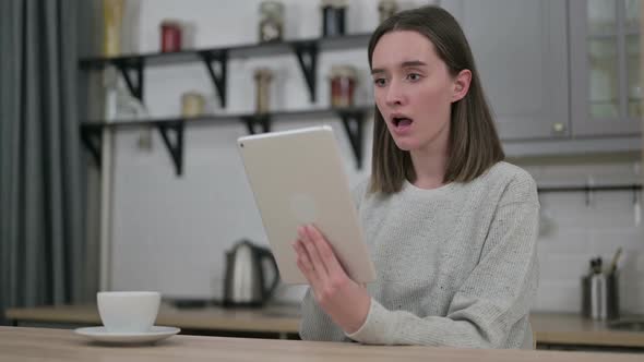 Sad Young Woman Reacting to Failure on Tablet in Living Room