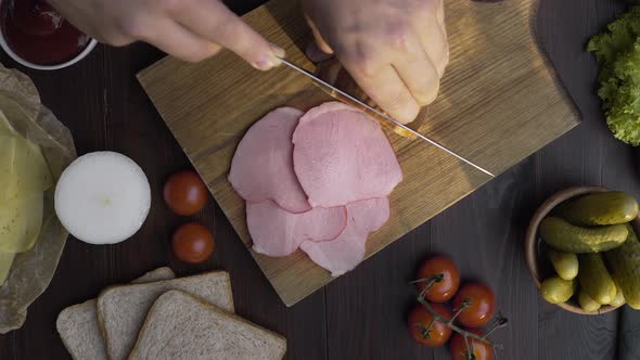 Tabletop Video of Tasty Natural Ham Is Sliced By Sharp Knife on the Wooden Board, Jerky Smoked Meat