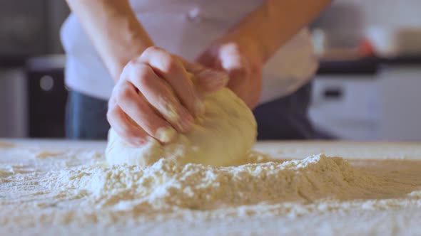 Close Up Making Dough By Female Hands at Bakery
