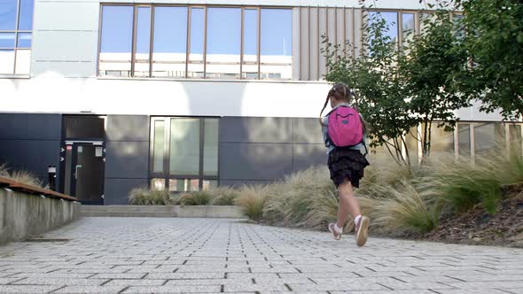 An Elementary School Student Hurries to School