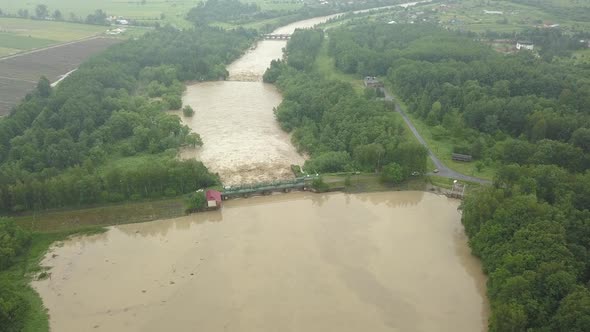 Aerial View of the Dam During Floods. Extremely High Water Level in the River.