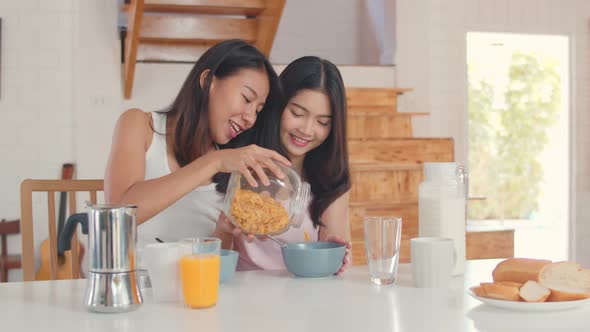 Asian Lesbian lgbtq women couple have breakfast at home.