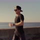 Running Man On Sea Coast Road Half Marathon. Runner Man In Sportswear Preparing To Triathlon. - VideoHive Item for Sale