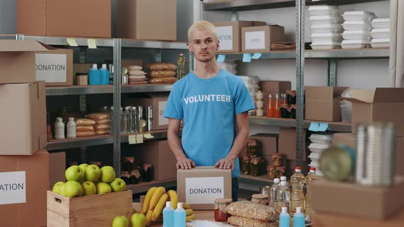 Portrait of Male Hipster Volunteering at Food Bank