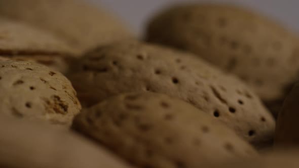 Cinematic, rotating shot of almonds on a white surface - ALMONDS 107