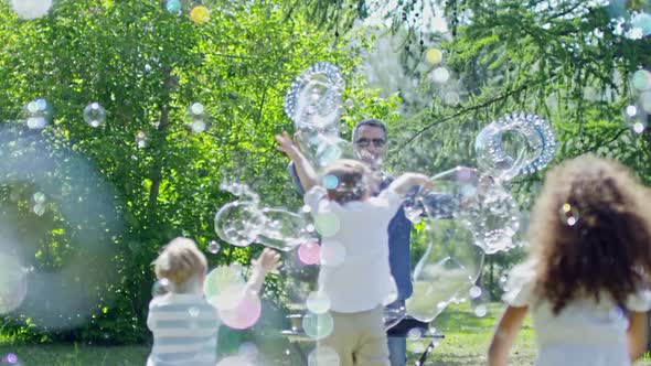 Little Children Playing at Outdoor Bubble Show