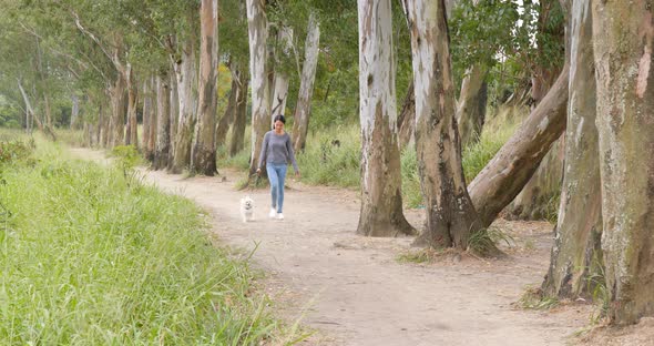 Woman walk with dog in park