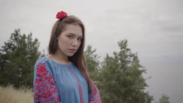 Beautiful Independent Girl Wearing Long Summer Fashion Dress Looking Confident at Camera Enjoying