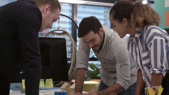 Creative Business People Group Having Conversation at Office Desk in Workplace