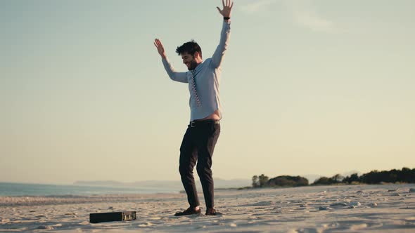 Business Man Dances at the Beach for the Milestone Reached