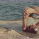 Blond Caucasian Female Yoga Teacher Practicing and Mastering Inverted Lotus Pose on a Cliff in Front - VideoHive Item for Sale