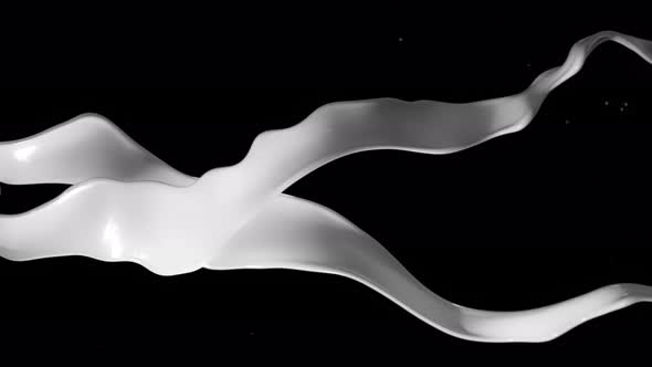 Super Slow Motion Shot of Twisting White Splash at 1000Fps Isolated on Black Background