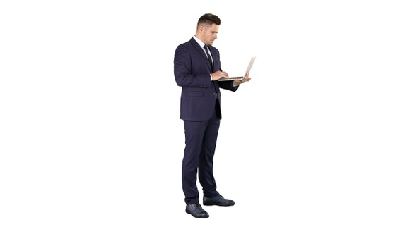 Businessman Standing and Using Laptop on White Background