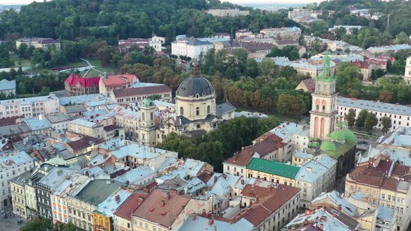 Aerial of a church in Lviv Ukraine on a summer day surrounded by European city buildings near Rynok