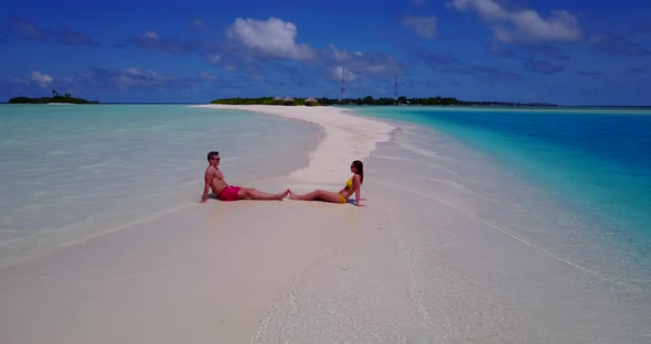 Romantic people on honeymoon vacation enjoy life on beach on sunny white sandy 4K background