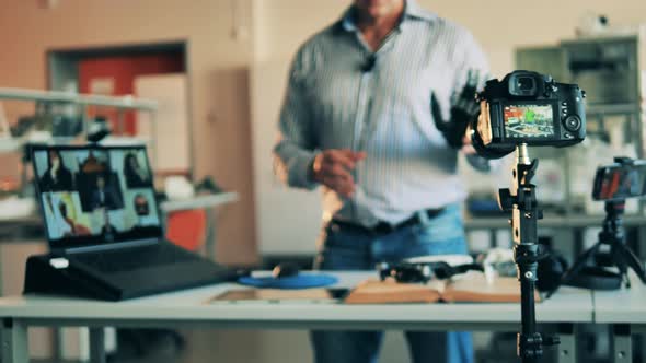 Robotics Lesson of a Male Tutor is Being Filmed Live