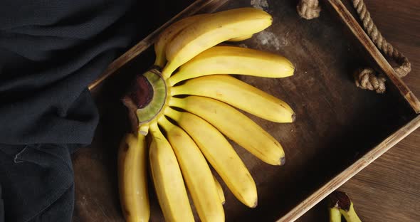 Fresh Bananas on Old Tray Is Slowly Rotating