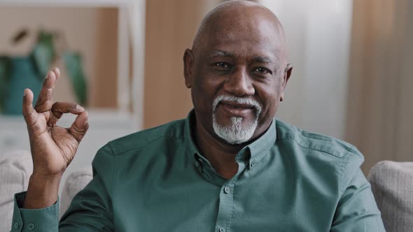 Close Up Smiling African American Mature Man Portrait Pleased Pensioner Male Sitting in Apartment