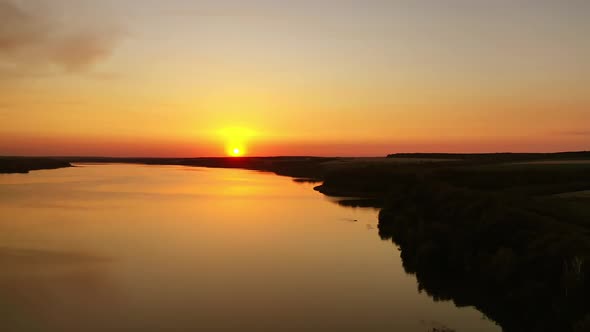 Rural river landscape. River view during colorful sunset