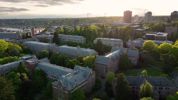 Orbiting aerial shot of Seattle's University of Washington campus at sunset.