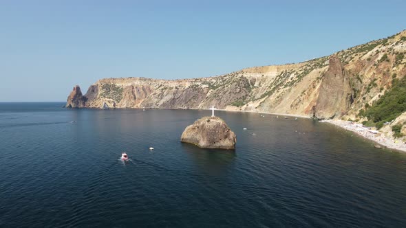 Aerial View From Above on Calm Azure Sea and Volcanic Rocky Shores