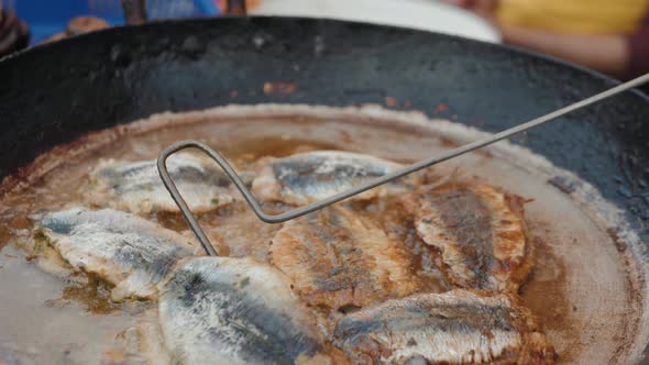 Deep Frying Fish Close Up Cooking on Street Ramadan Kareem Market