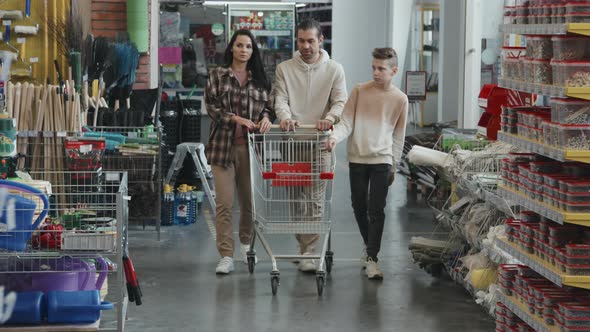 Family of Three Walking through Hardware Store