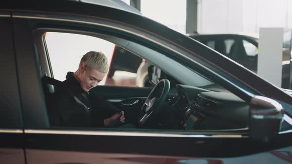 Side View of Successful Caucasian Woman Fastening Seat Belt in Slow Motion