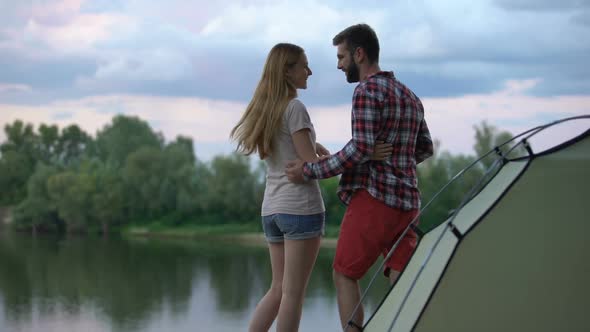 Man Making Proposal to Beloved Woman in Beautiful Forest During Camping Trip