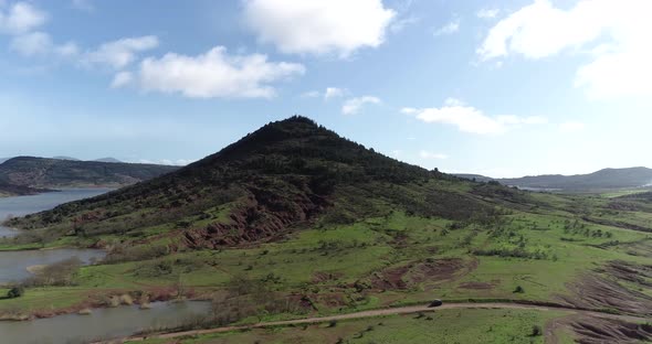 Drone View Over Red Mountain Lake Salagou During the Day in South of France