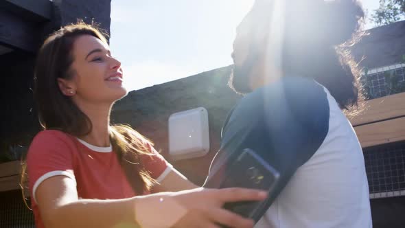 Couple hugging at outdoors cafe 4k