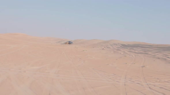 Car is Driving in the Desert
