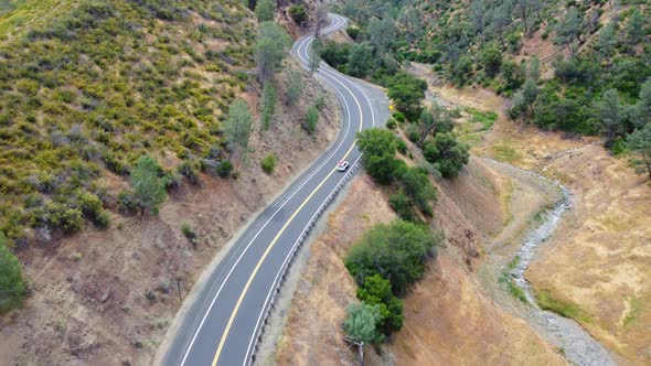 Aerial View A Car Driving Along Serpentines in the Mountains of California