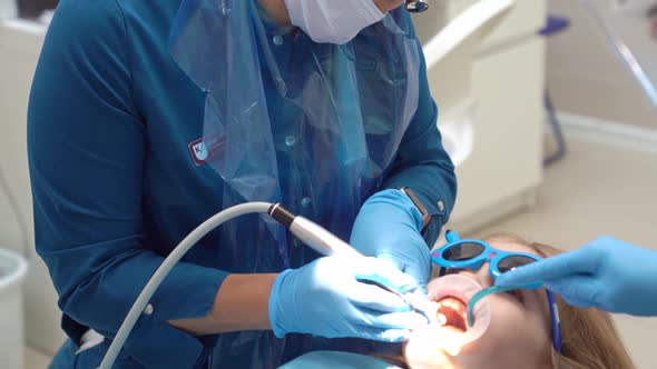 Kid Girl with Oral Dilator at Dentist's Appointment