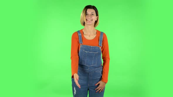 Happy Woman Waving Hand and Showing Gesture Come Here. Green Screen