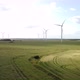 A rising view of wind turbines in a field, sustainable, environmental  - VideoHive Item for Sale
