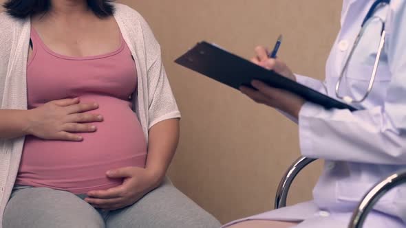 Pregnant Woman and Gynecologist Doctor at Hospital