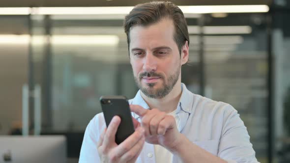 Man Using Smartphone Browsing Internet