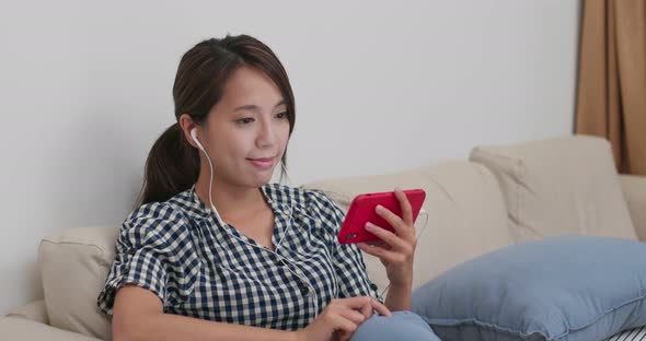 Woman use of mobile phone at home