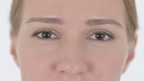 Close Up of Blinking Eyes of Woman Looking at Camera