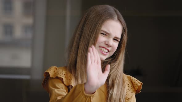 Young Girl Teenager Schoolgirl Daughter Child Posing Standing Indoors Grimace on Face Feels Disgust