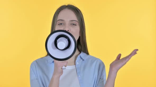 Young Woman Making Announcement on Loudspeaker