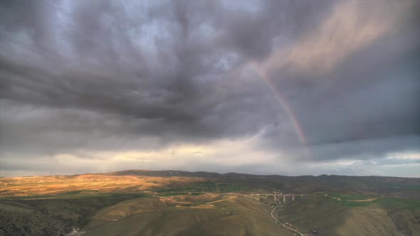 8K Rainbow in a Gloomy Grey Cloudy Sky