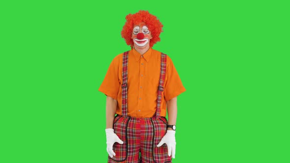 Funny Clown Looking at Watch and Running Away Being Late on a Green Screen, Chroma Key.