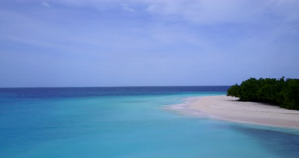 Natural above travel shot of a white sand paradise beach and aqua turquoise water background in best