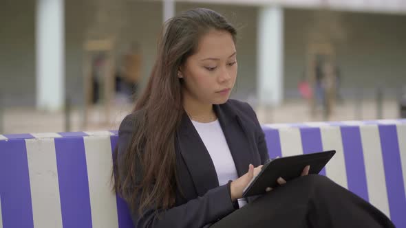 Attractive Focused Girl Using Digital Tablet