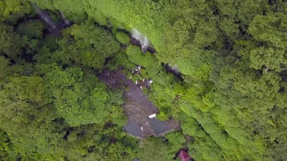 waterfalls in a dense jungle.Gorgeous aerial view flight bird's eye view drone footageWaterfall Be