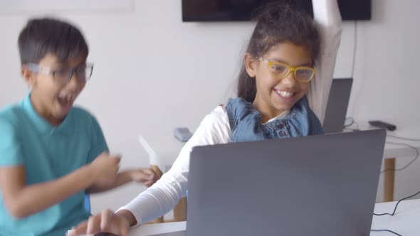 Couple of Excited Classmates Working on Task